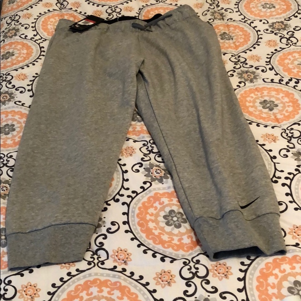 NWT Nike dry fit joggers grey with swoosh on leg